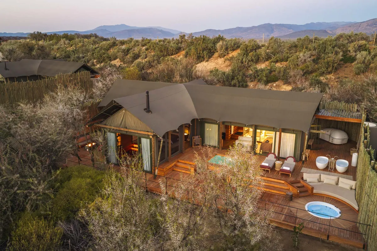 A suite at dusk with the watering hole and ranges beyond