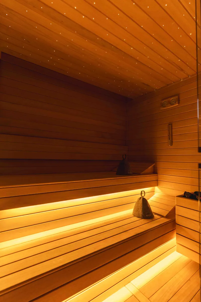 A softly lit sauna bench