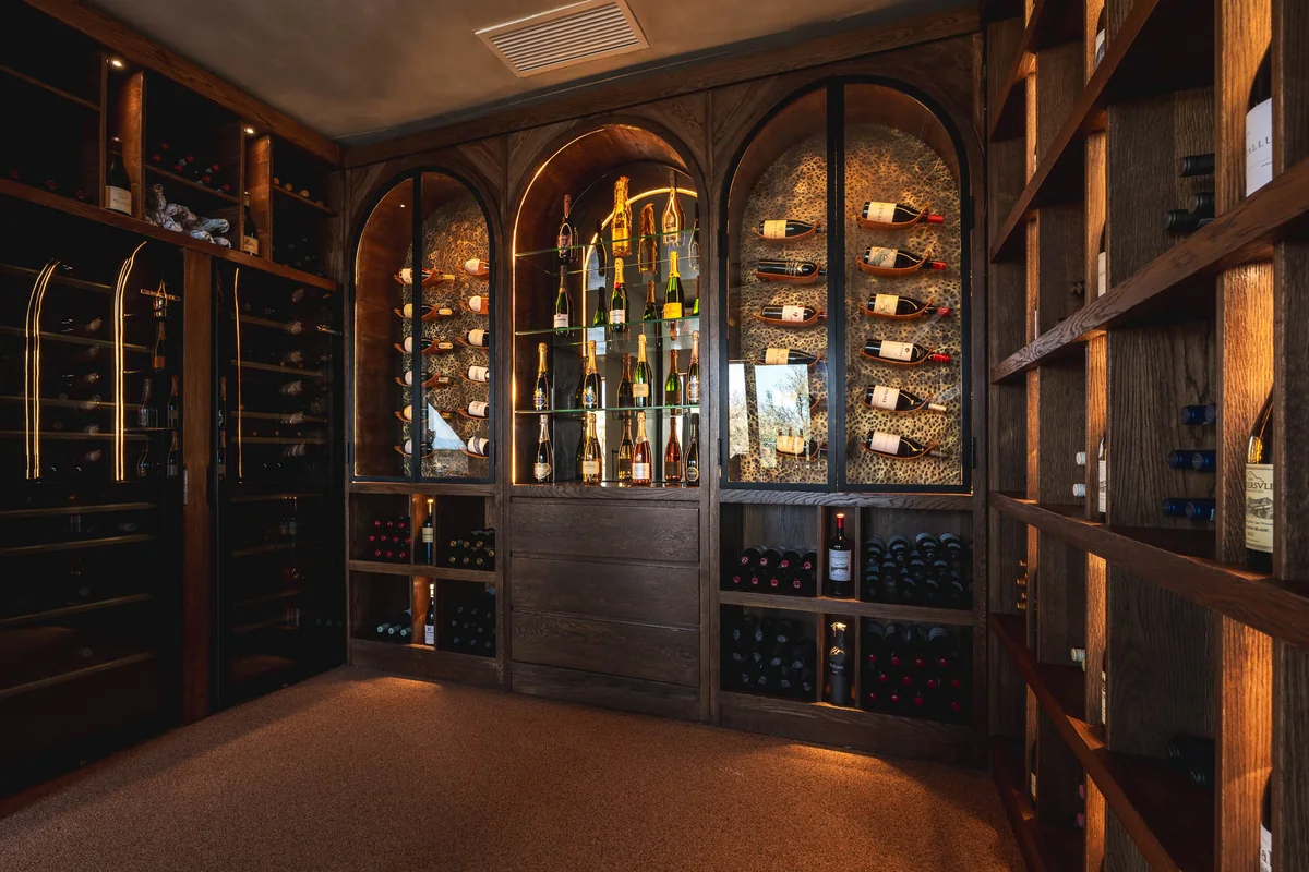 The wine cellar with arched cabinets